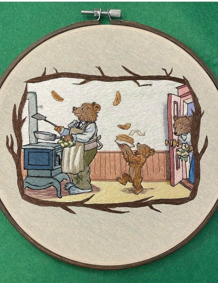 Detailed embroidery projects depicting a family of bears cooking pancakes in a cozy kitchen.