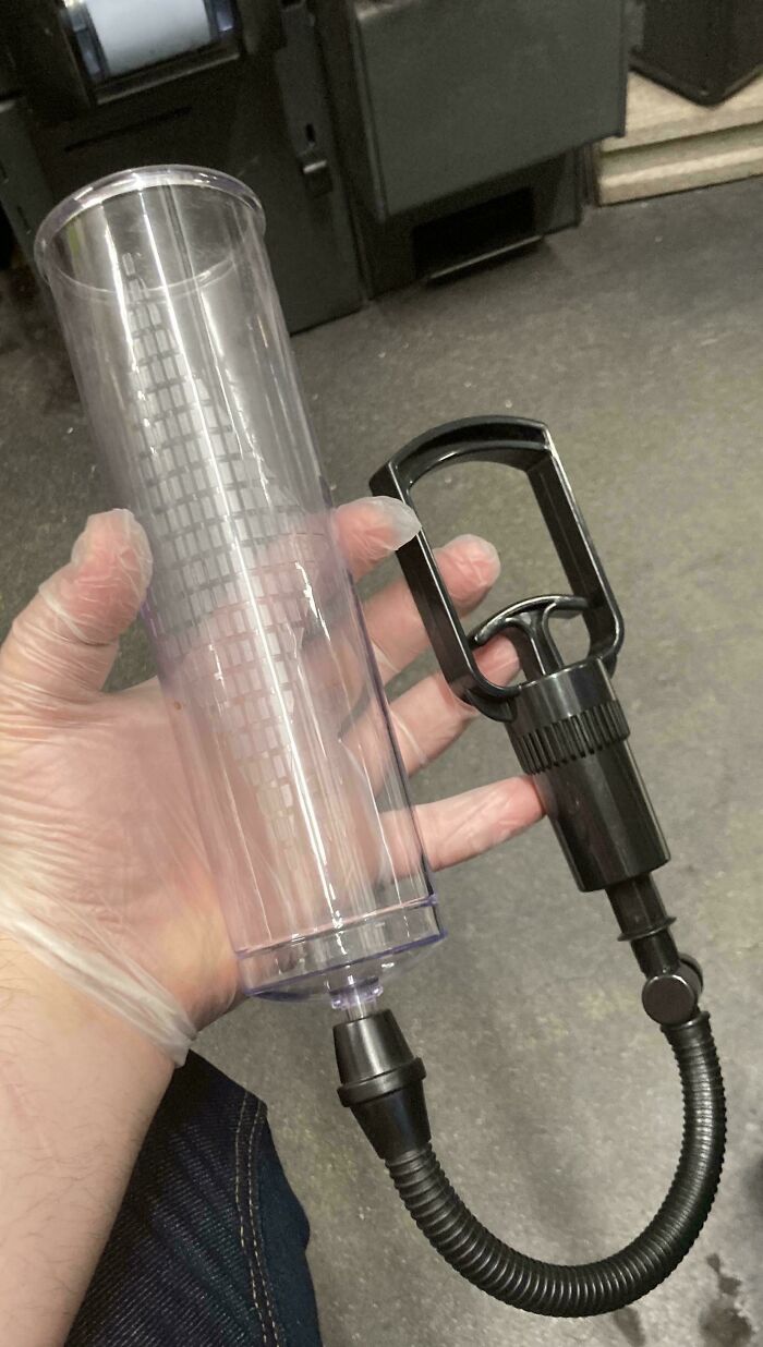 A gloved hand holds a clear plastic pump device, one of the things that should be left alone.