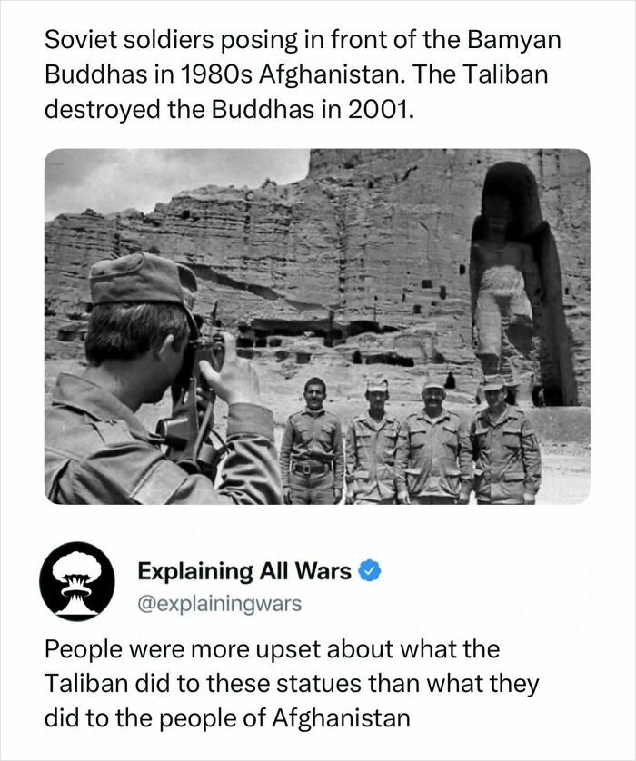 Soviet soldiers posing in front of the Bamyan Buddhas in Afghanistan, a piece of history related to wars.