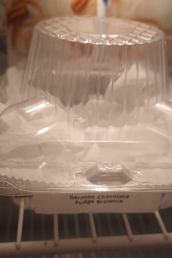 A clear plastic container for a German Chocolate Fudge Brownie, a common item found with horrible roommates.