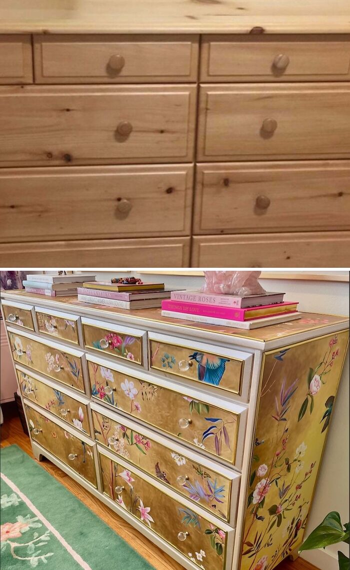 An old piece of furniture, a wooden dresser, revived with golden floral wallpaper and clear knobs.