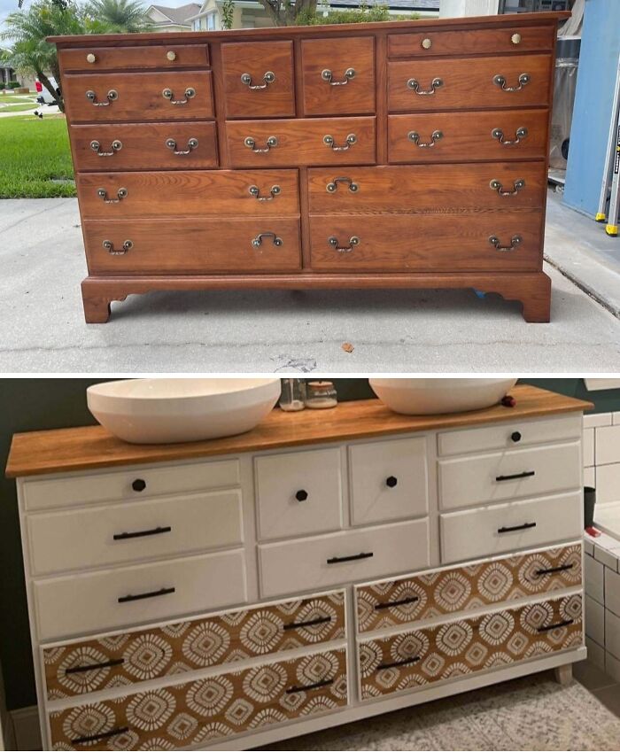 An old piece of furniture, a large wooden dresser, transformed into a stylish bathroom vanity with dual sinks.