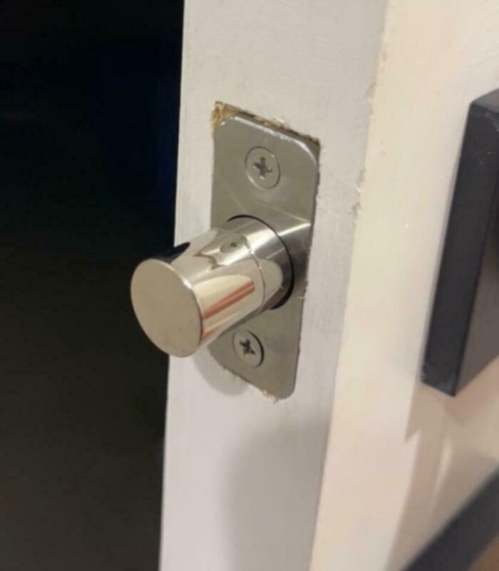 A close-up of a door's deadbolt, highlighting how a horrible landlord can make a tenant's life miserable by changing locks.