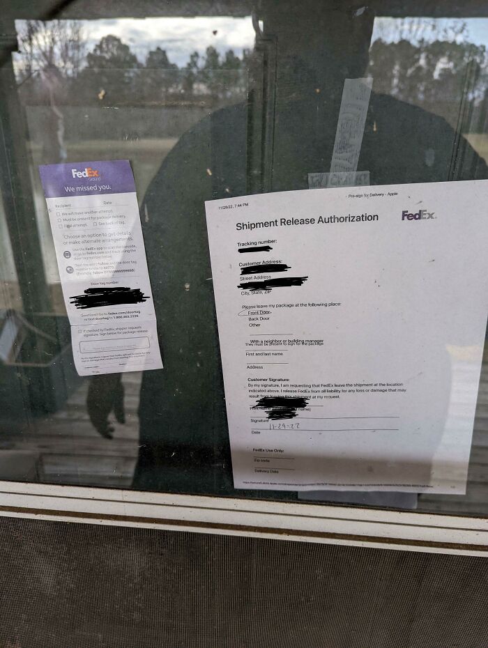 A FedEx delivery fails notice and release authorization form stuck to a glass door, highlighting delivery fails.
