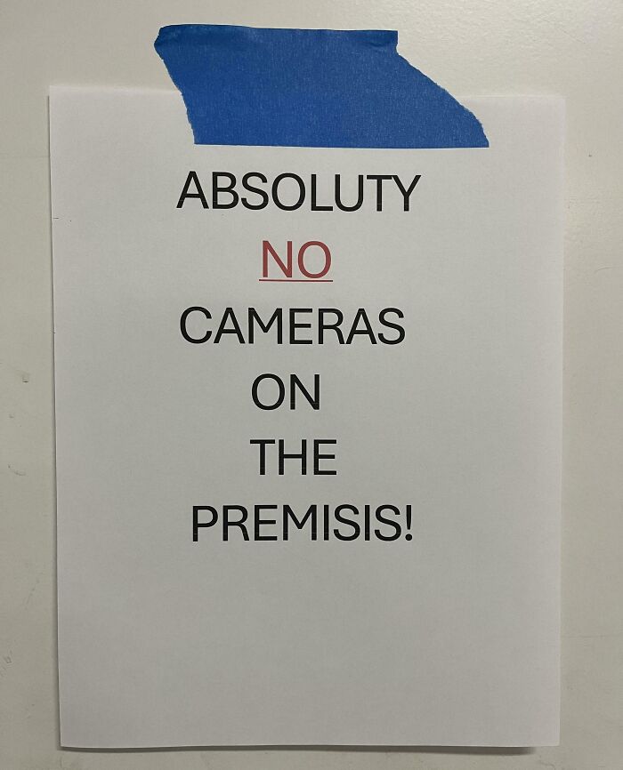 A poorly spelled sign from a horrible landlord, making a tenant's life miserable by prohibiting cameras on premises.