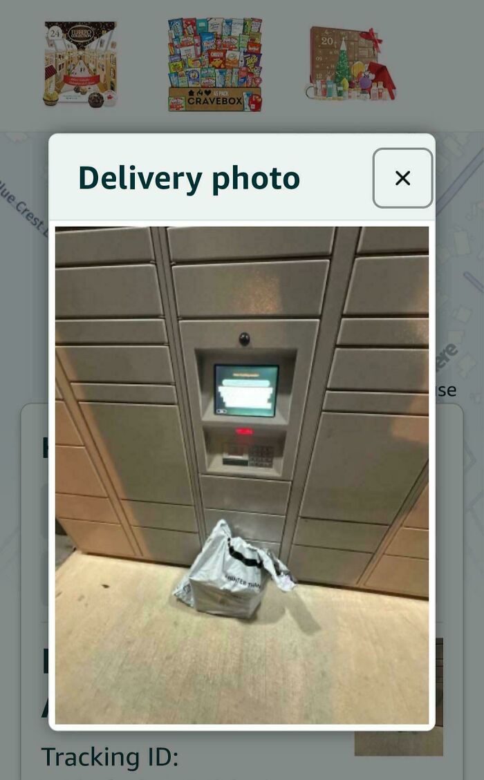 A package, a delivery fail, left on the ground in front of a parcel locker with a delivery photo popup.