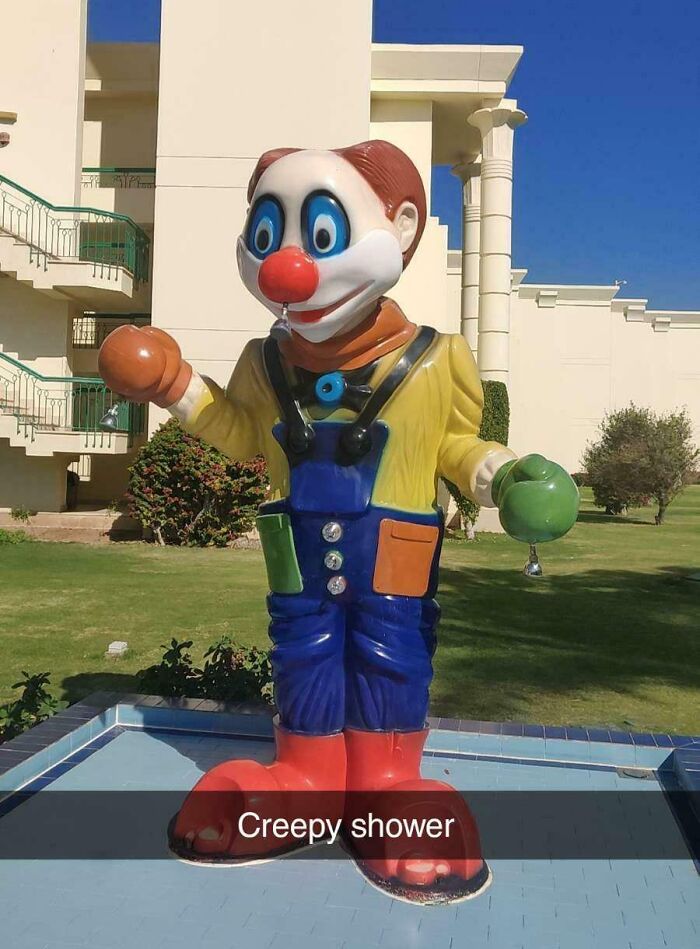 Creepy clown design fail as an outdoor shower makes people feel uncomfortable with its strange appearance.