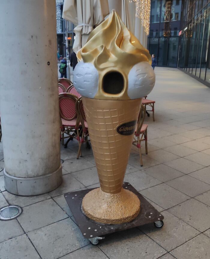 Uncomfortable design fails: a giant ice cream cone with an oddly placed birdhouse opening.