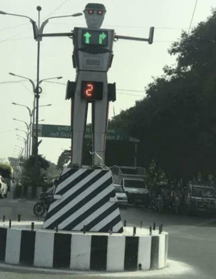 A robot-shaped traffic light with a number 2 showing, an example of a design fail making people feel uncomfortable.