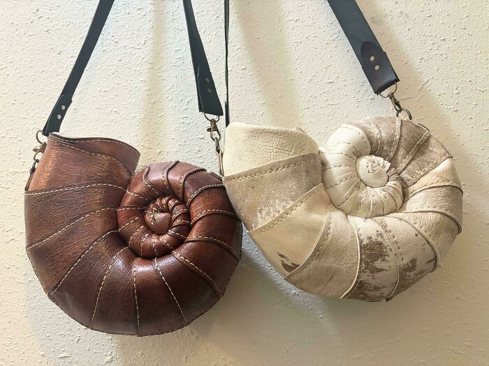 Two unique nautilus shell-shaped handmade projects, bags made from leather, showing great talent.