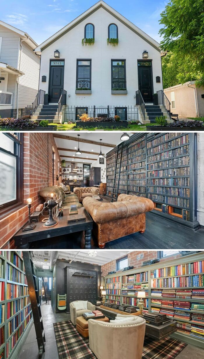 A narrow, tall unusual home with two black doors, revealing an interior with a floor-to-ceiling bookshelf, a large library, and leather furniture.