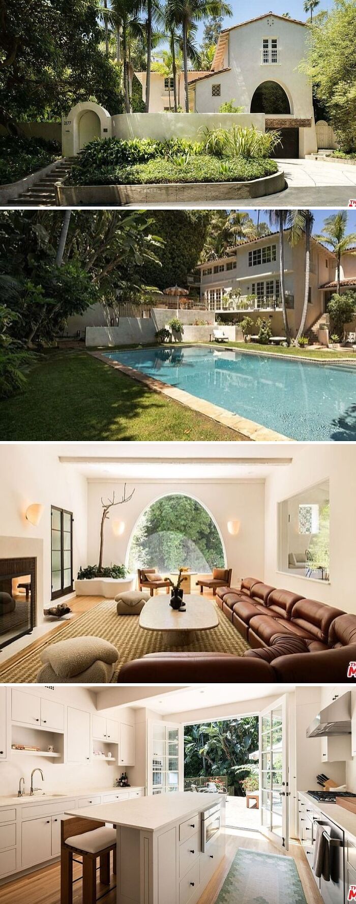 A cool and unusual home with a lush green lawn, large swimming pool, and a unique arched window in the living room.