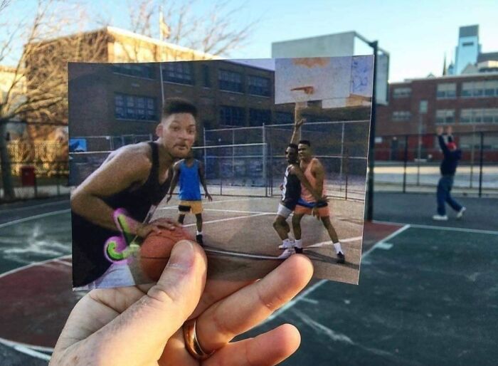 A hand holding a photo of Will Smith playing basketball on an outdoor court, showing how much America has changed.