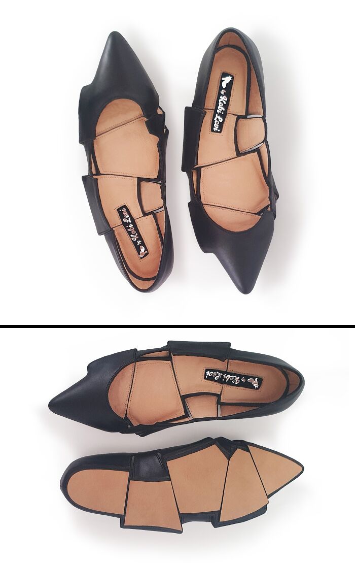 A pair of black Kobi Levi imaginative shoes with a cut-out design and pointed toes, seen from above.