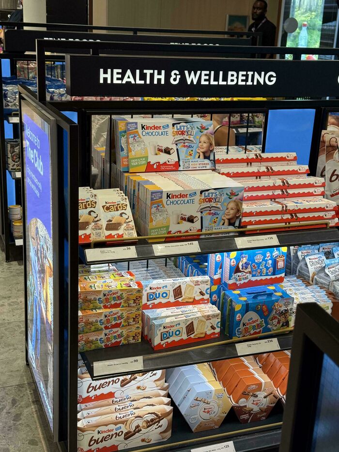 Funny fails: A display of Kinder chocolates under a Health & Wellbeing sign.