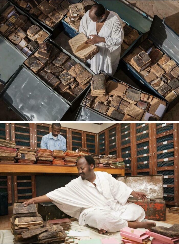 Two men organizing and examining ancient manuscripts in a large library, an interesting photo.