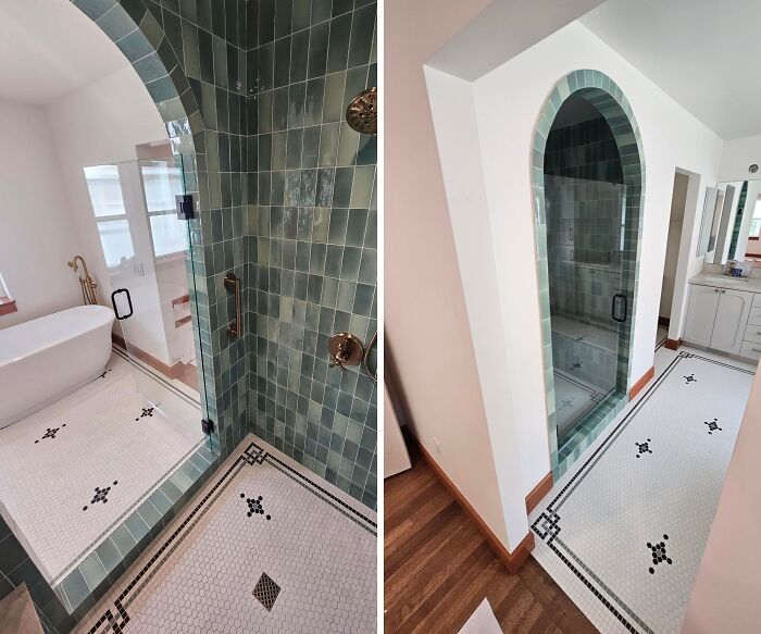 Modern bathroom home renovation with a stylish tiled shower arch and new flooring.