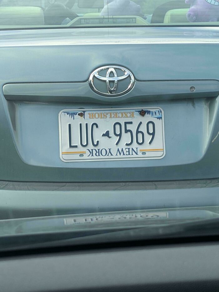 Funny you had one job fail: a car with a New York license plate installed upside down, displaying LUC-9569.