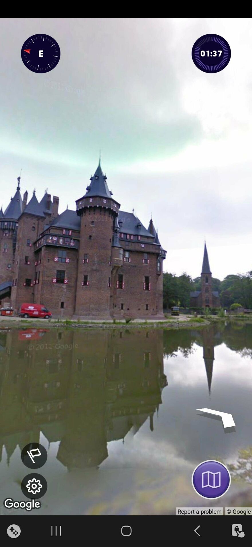 A historic castle reflected in water, captured in a bizarre Google Street View image.