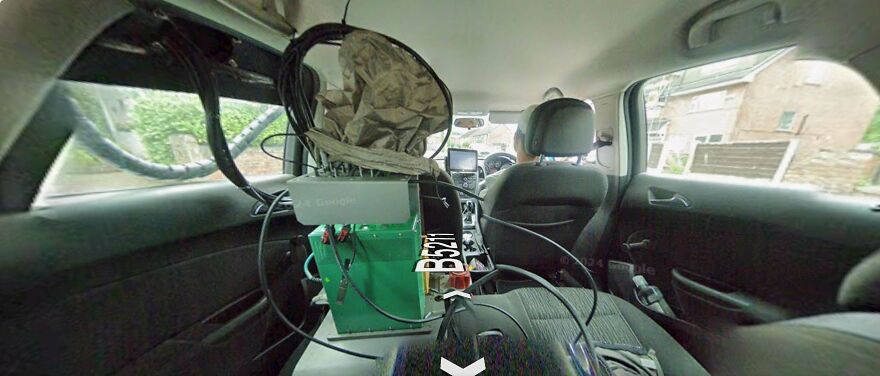 A car interior with Google Street View camera equipment, showcasing the bizarre setup for capturing Google Street View photos.