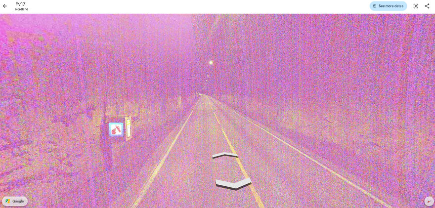 A bizarre Google Street View photo showing a road at night with intense pink and purple noise overlaying the image.