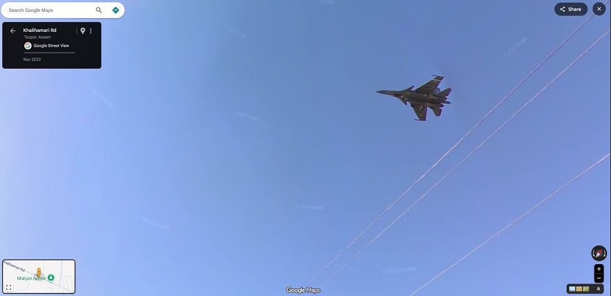 A military jet flying high in the sky, captured in a funny Google Street View photo.