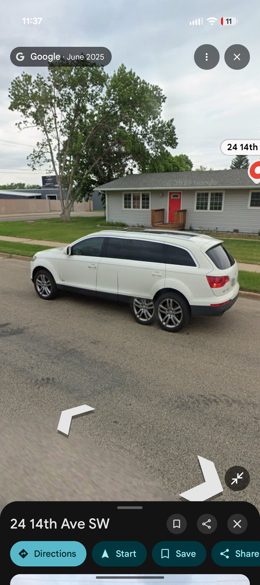 A bizarre Google Street View photo showing a car with distorted, extra wheels parked on a street.