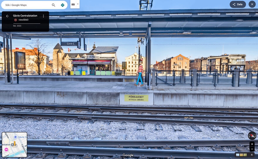 A funny Google Street View image showing a person in a striped shirt walking on a train platform.