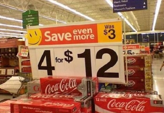 A supermarket sign advertises Coca-Cola 4 for $12, down from $3 each, a funny 'When You See It' pricing error.
