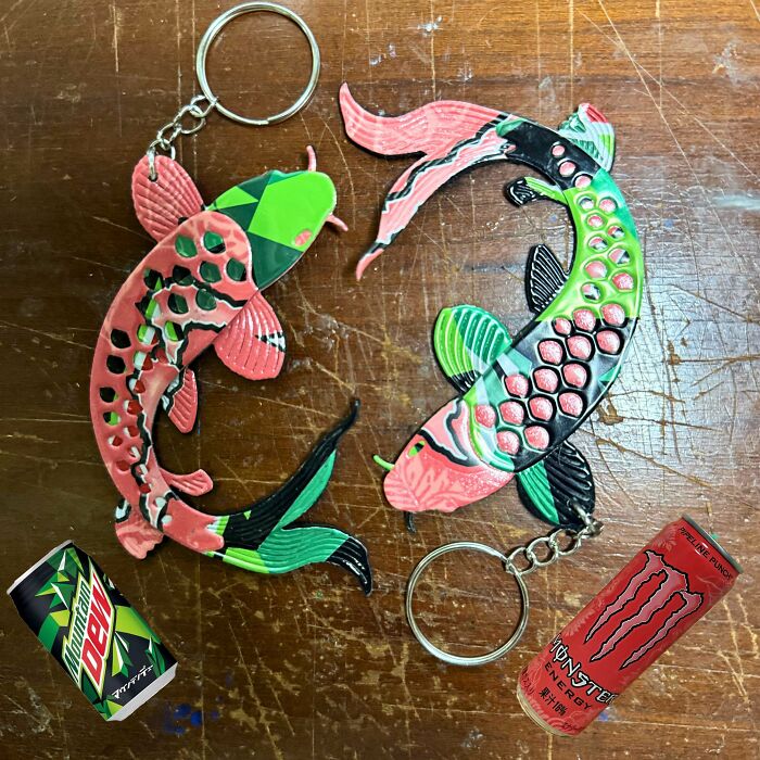 Two fish-shaped keychains next to energy drinks, highlighting unexpected things people made out of things that would’ve been thrown away.