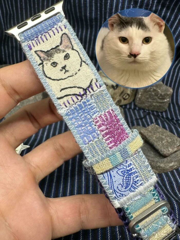 A cat image is made on a watch strap, repurposed from things that would've been thrown away.