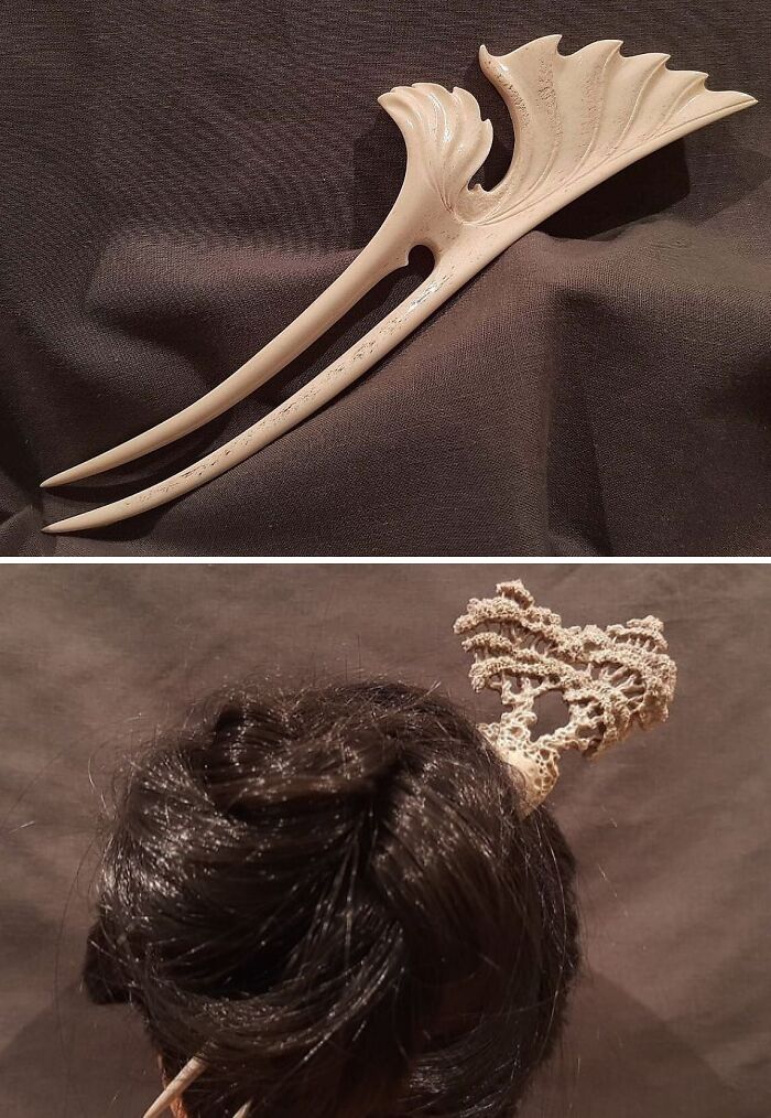An elegant, sculpted hair pick, artfully made from things that would've been thrown away, holds up dark hair.