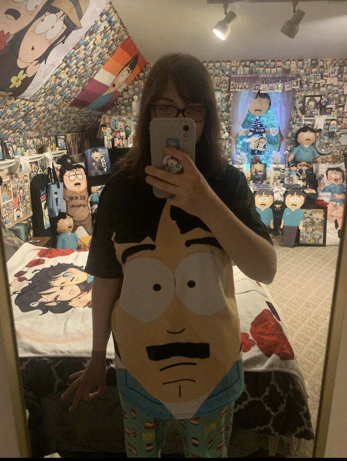 A person in a room filled with a fascinating collection of South Park merchandise, displaying a unique fandom.