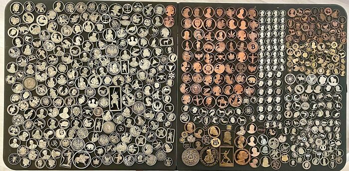 A large display of various pressed pennies and tokens, showcasing fascinating collections with diverse designs.