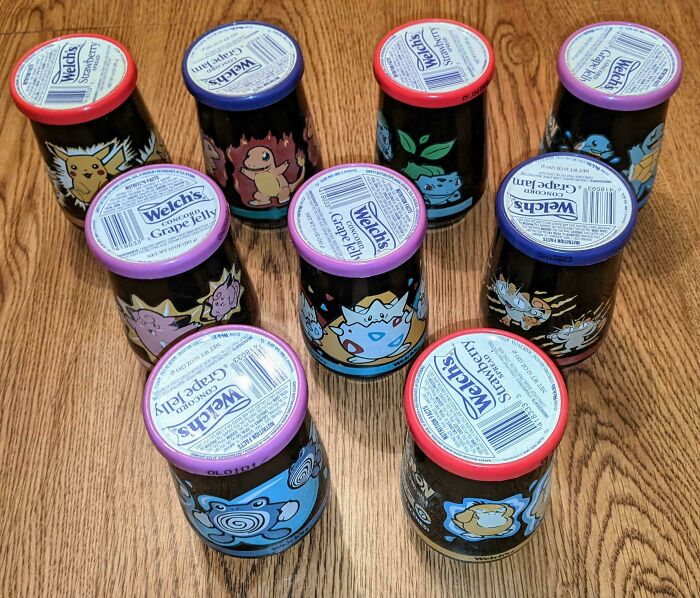 A charming collection of Welch's grape jelly jars, each featuring a different Pokémon character, a fascinating collection.