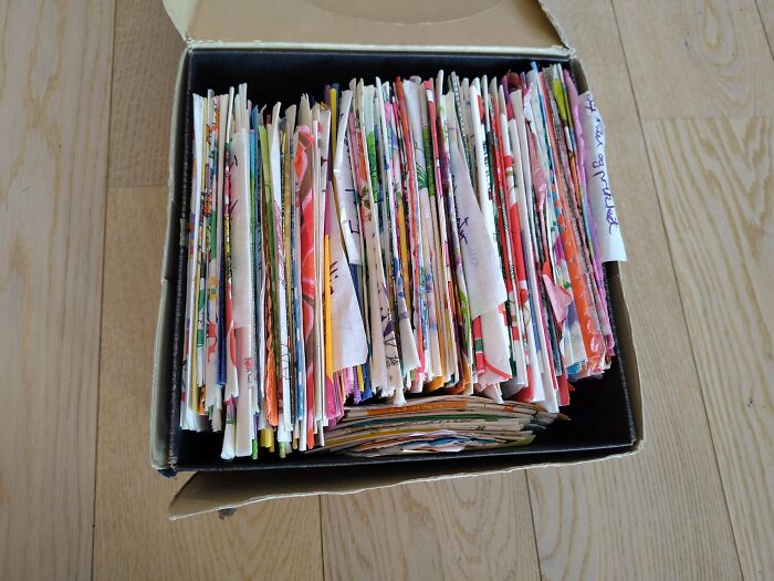 A box filled with a fascinating collection of colorful, patterned handkerchiefs, showcasing an unexpected hobby.