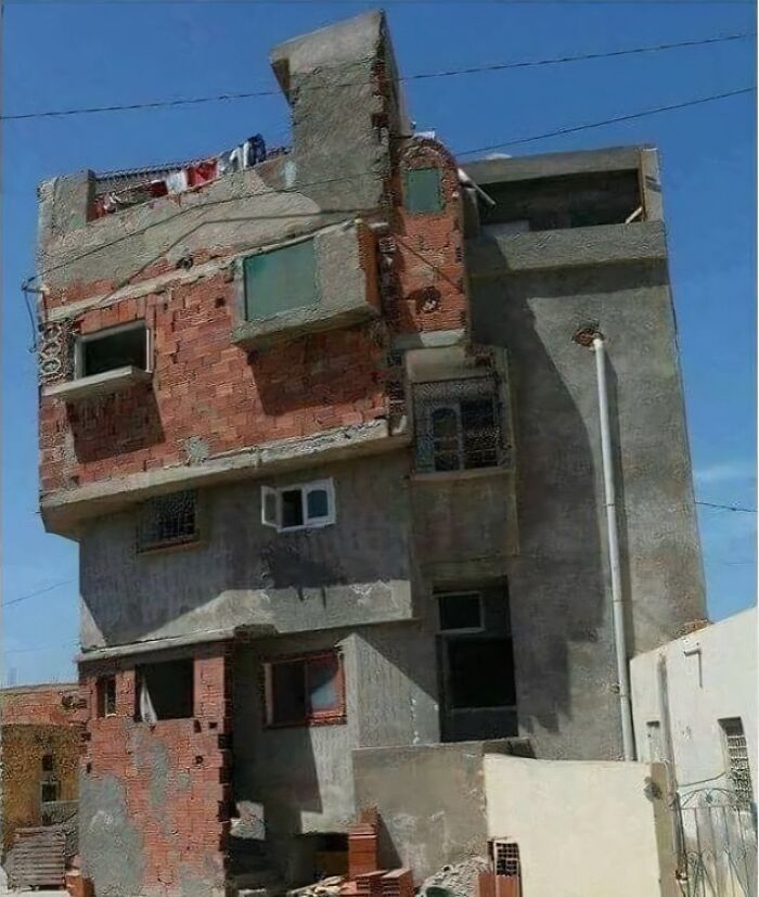 A poorly designed building facade showing architecture fails and exposed brickwork.