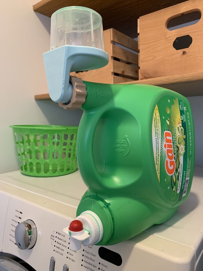 A functional 3D print dispenser attached to a large detergent bottle, making everyday life much easier.