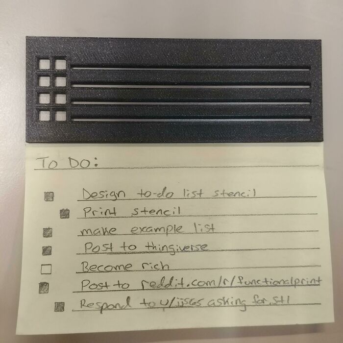 A black stencil over a yellow sticky note with a to-do list, an example of functional 3D prints.