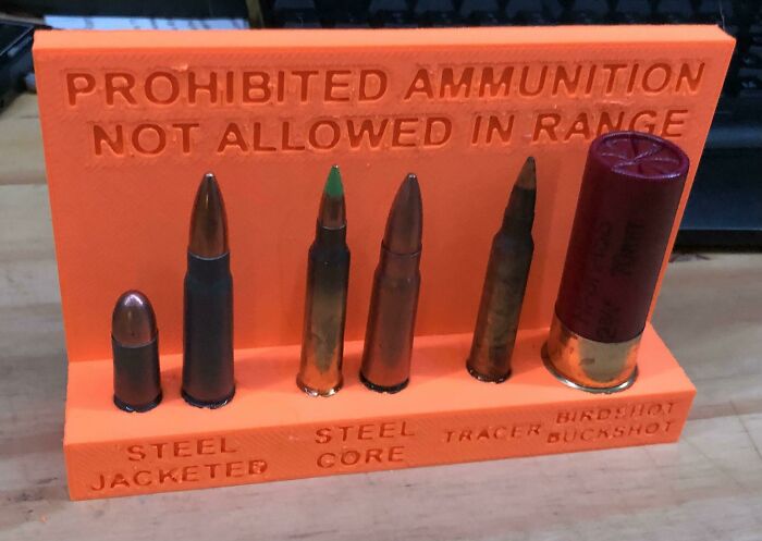 A 3D print sign with various ammunition types deemed prohibited, helping with everyday life organization.