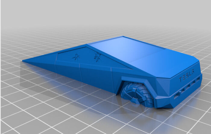 A blue 3D print of a Tesla Cybertruck model, showcasing a functional print that makes tasks easier.