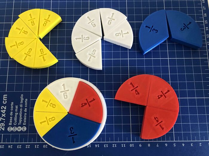 Colorful, functional 3D prints of fraction manipulatives, useful for making math learning easier.