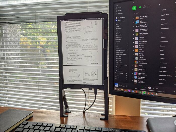 A functional 3D print: a custom-designed stand holding an e-reader device, making everyday life easier.