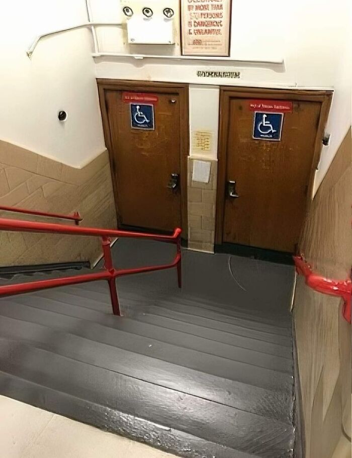 Two doors for disabled access at the bottom of a steep staircase, a ridiculous You Had One Job fail.