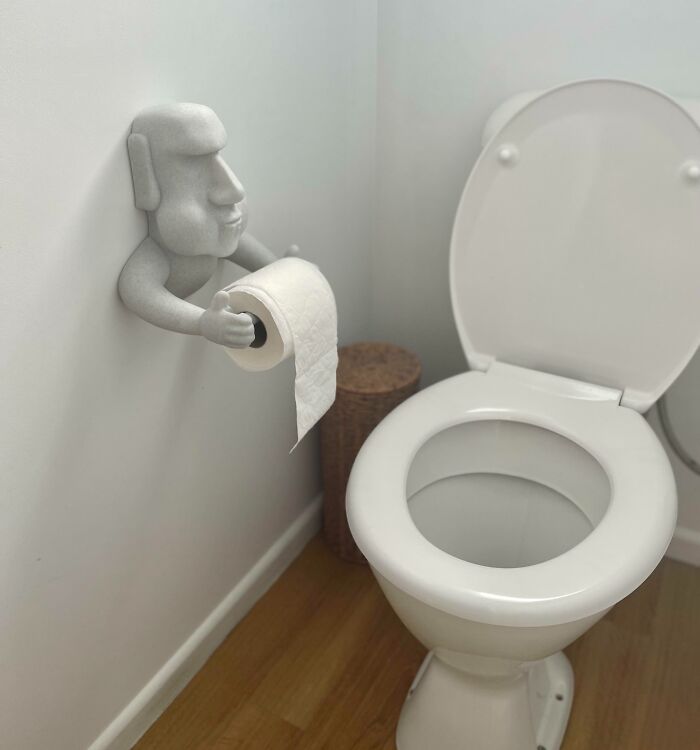 A creative 3D print of a figure holding a toilet paper roll, making everyday life much easier.
