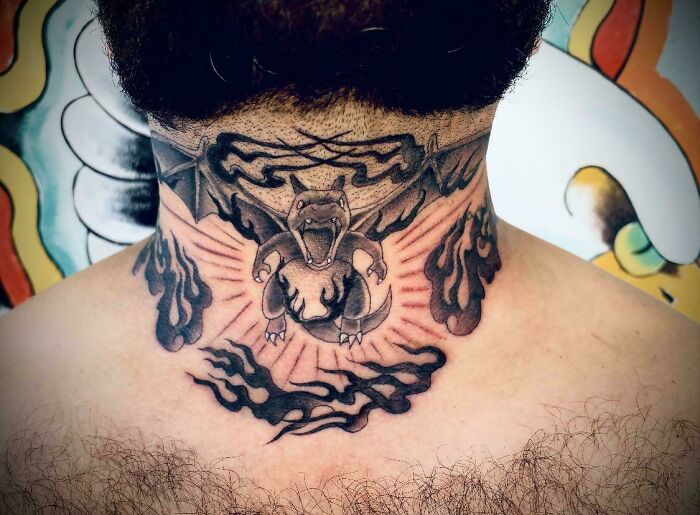 A tattoo artist's talent is wasted on a questionable tattoo idea of Charizard on a person's neck.
