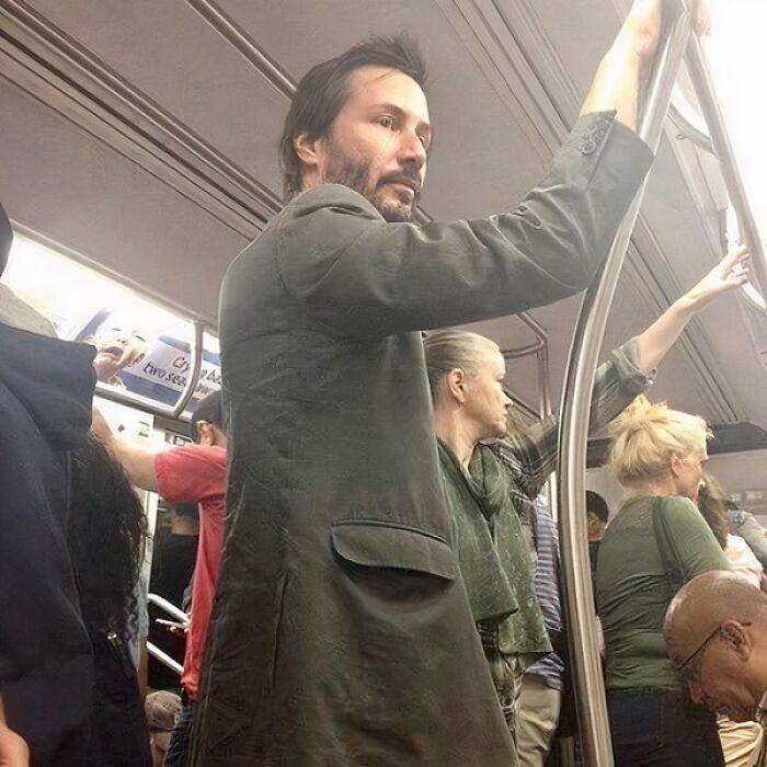 Keanu Reeves standing in a subway, a surprising and soul-healing celebrity sighting.