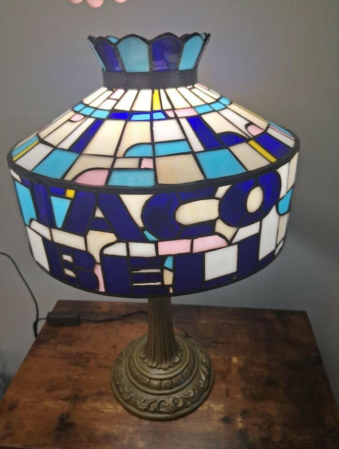 A stained glass lamp with 'Taco Bell' spelled out, a peculiar marketplace listing.
