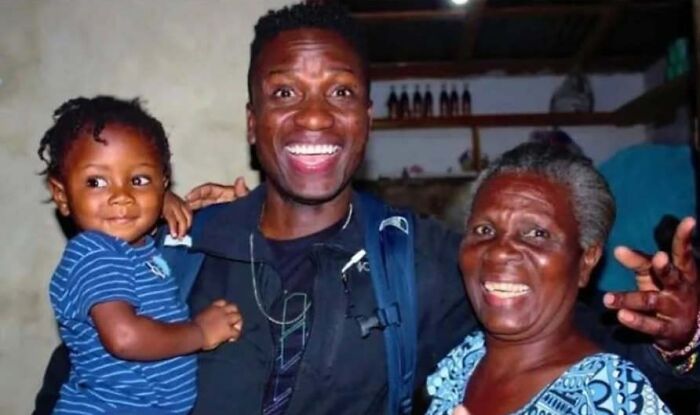 A man, a young child, and an elderly woman smiling broadly, a soul-healing family moment.