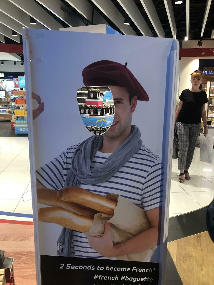 A cutout of a man with a missing face, a ridiculous you had one job fail showing common sense isn't common.